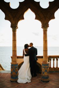 bride and groom water backdrop